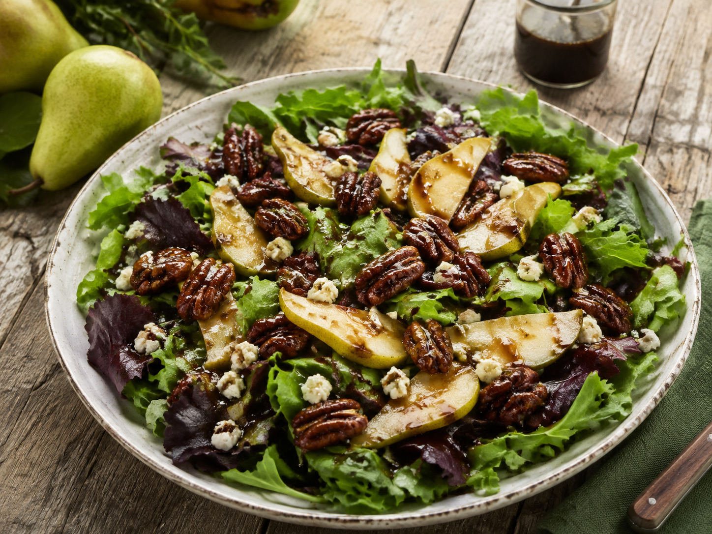 Green salad with candied pecans and maple balsamic vinaigrette